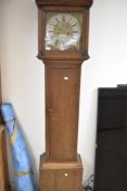 An 18th Century oak long cased clock having eight day movement having square hood and column