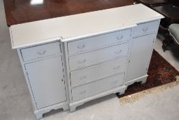 A reproduction breakfront sideboard of small proportions having painted finish, width approx. 120cm