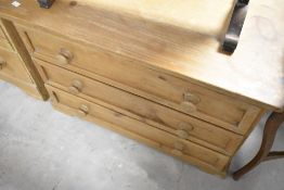 A natural pine chest of three long drawers, width approx. 86cm