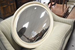 A traditional oval wall mirror, approx. 102 x 71cm