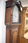 A 19th Century mahogany and oak long cased clock having 30hr movement and painted arched dial, named