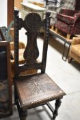 A period oak carved high back chair