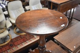 A 19th Century mahogany occasional table having circular top, turned column and triple splay legs,