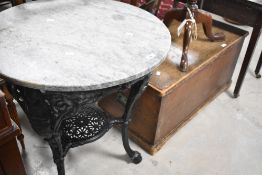 A 'Britannia' cast iron pub table having marble top, diameter 65cm