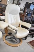A Stressless swivel cream leather armchair