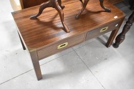 A reproduction campaign style coffee table, approx. 91 x 46cm