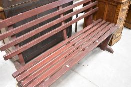 A stained frame wooden slatted garden bench , width approx. 155cm