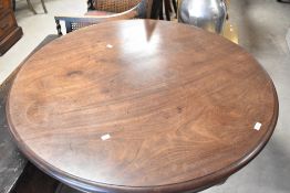 A William IV mahogany dining/breakfast table having circular top on typical triform platform base