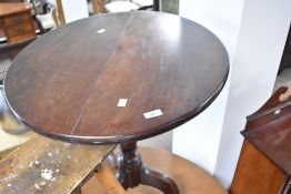 A 19th Century mahogany pedestal table having oval top , turned column and triple splay legs,