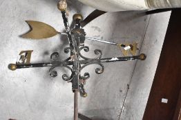 A traditional wrought iron weather vane