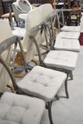 A set of six bentwood chairs, limed effect, with canework seats and cushioned seat pads