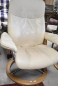 A Stressless swivel cream leather armchair