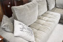 A modern L shaped settee in grey upholstery , labelled FAMA, originally purchased from Darlings of