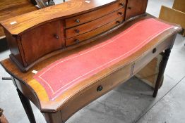 A reproduction mahogany writing desk