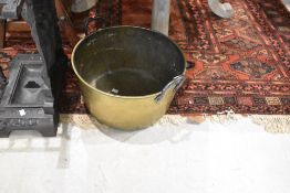 A traditional brass two handled jam pan