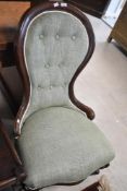 A Victorian mahogany framed nursing chair having later button back upholstery