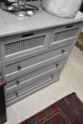 A modern chest of two short cane work fronted over three long drawers, painted grey effect finish,