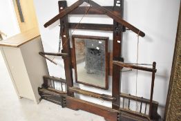 An interesting mirror, constructed from weaving loom parts from woolen mill