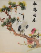 A group of three Chinese silk-work embroideries, each depicting birds, blossoms and four Chinese