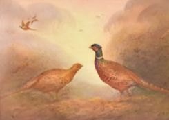 A pair of early 20th century hand-painted Crown Devon porcelain plaques, decorated with pheasants