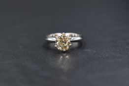 A platinum diamond solitaire ring, the old cut diamond being approx 1.9ct set in a modern six claw V