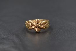 A 9ct gold Celtic knot motif ring, marked 375, ring size S, 4.7g
