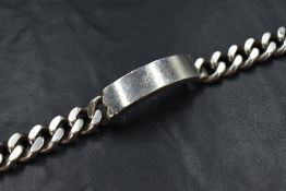 A heavy silver identity bracelet, the vacant panel on a curb link bracelet, 21cm, 88.2g