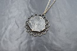 An Eight Reales 'Piece of Eight' coin, from the Lucayan Beach Pirate Treasure Trove of 1628,