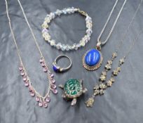 A collection of silver jewellery, including a lapis lazuli set pendant marked 925, an articulated