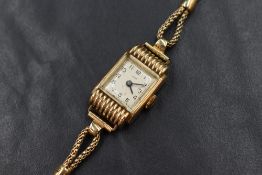A 9ct gold Summit wristwatch, the champagne dial having Arabic numerals in a decorative