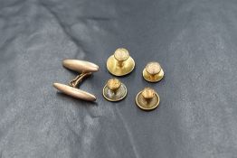 Four 9ct & 15ct gold collar studs, approx 2.7g total and a single yellow metal cuff link, no marks