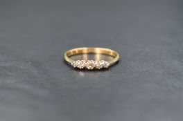 An 18ct gold diamond set five stone ring, the graduated diamonds measuring between 0.04ct and 0.