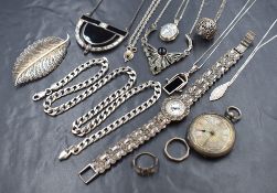 A collection of silver and white metal jewellery, including a marcasite set wristwatch, necklaces