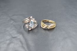 A 14ct white gold ring having a central synthetic blue spinel within triple crossover shoulders with