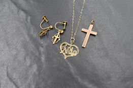 A 9ct gold 'Nan' heart necklace, marked 9ct on a 9ct gold chain marked 9k, along with a 9ct rose