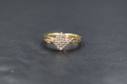 A 9ct gold diamond square cluster ring having sixteen small diamond chips in a pave set square mount