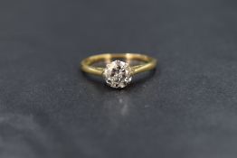 An 18ct gold diamond solitaire ring having a 1ct brilliant cut diamond in a eight claw set mount