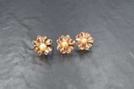 A pair of rose gold pearl earrings with matching ring stamped 9ct, the earrings each having a