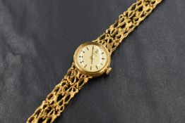 A 9ct gold cased Omega wristwatch, the champagne dial having baton numerals, on a 9ct gold