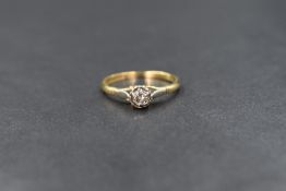 An 18ct gold diamond set solitaire ring, the illusion set round brilliant cut diamond measuring