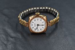 A 9ct gold cased Limit III wristwatch, the white circular dial in a square case marked 375, having