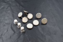 A cased set of 9ct white gold and mother-of-pearl set cufflinks and collar pins, of circular form