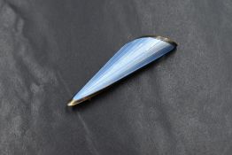 An Oystein Balle Norwegian silver enamel brooch, the decorative scroll motif brooch with pale blue