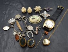 A selection of vintage costume jewellery including a gent's Perona wrist watch, white metal charm