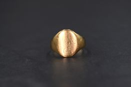 A 9ct gold signet ring of plain form, size L/M & approx 2.1g, signs of wear