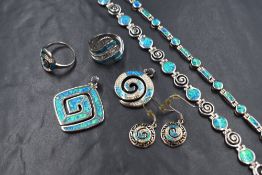 A selection of white metal and enamel jewellery stamped 925 and in shades of blue/green, including