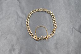 A 9ct gold open curb link bracelet with safety chain, approx 180mm long & 5.1g