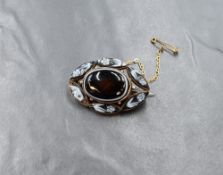 A Victorian rose metal presumed gold banded agate set mourning brooch, the central bezel set agate