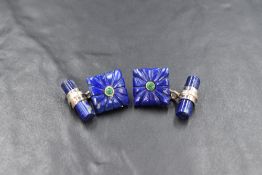 A pair of silver mounted lapis lazuli cufflinks having carved front panels with chain connectors