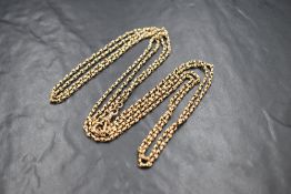A yellow metal fancy link muff chain, marked 9c, approximately 68' & 27.9g, tests as 9ct gold